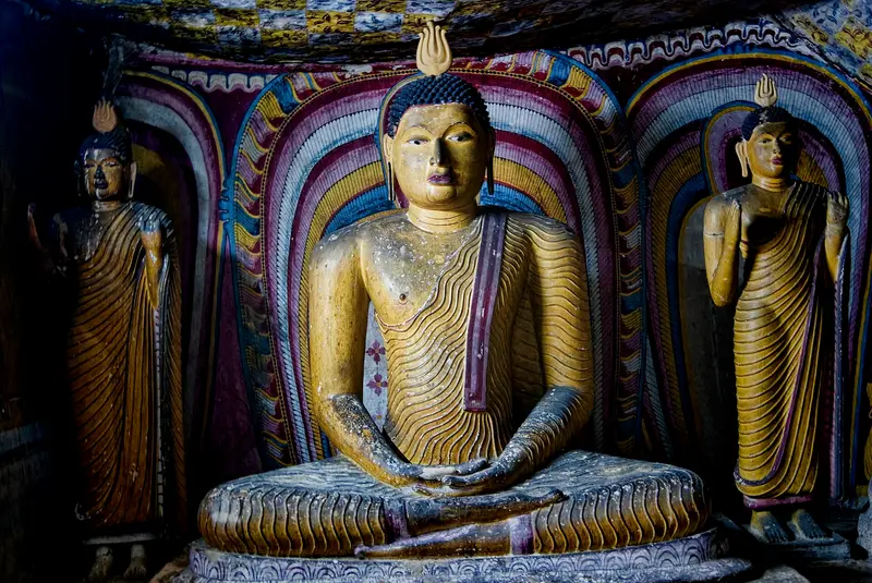 Painted Buddha statues inside the Dambulla cave temple